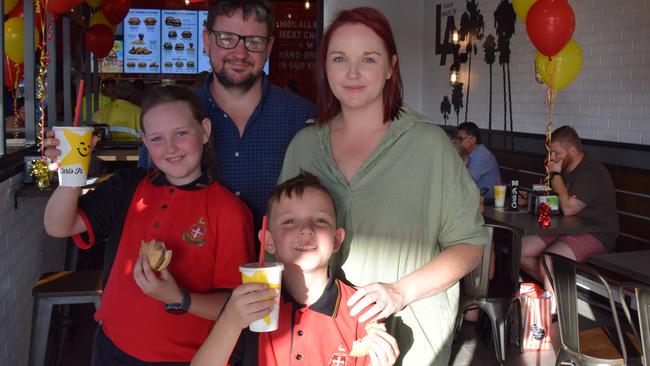 Sasha and Lewis Carolan with children Ava, 10, and Leo, 7, trying out Carl's Jr on the opening day on Tuesday. The children gave the burgers a big thumbs up.