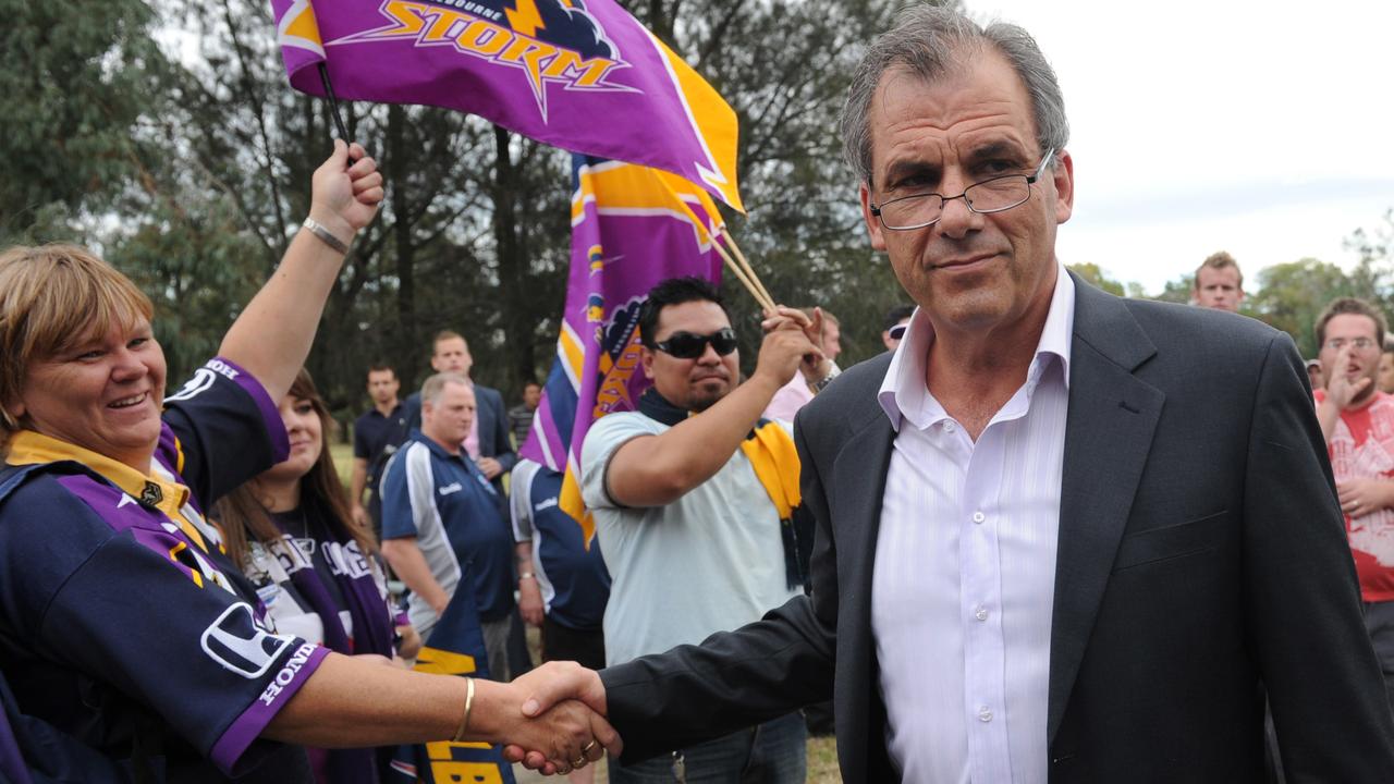 Melbourne Storm chairman Rob Moodie shakes hands with fans after a media conference at Princess Park in Melbourne, in April 2010. Picture: AAP Image/Julian Smith