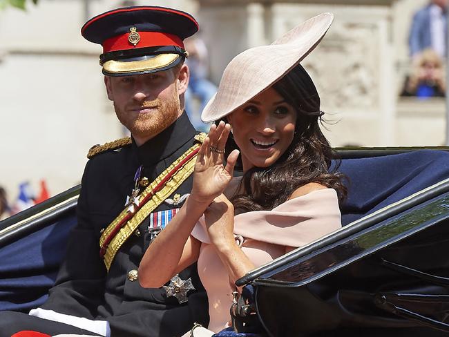 Prince Harry, Duke of Sussex and Meghan, Duchess of Sussex return in a horse-drawn carriage after attending the Queen's Birthday Parade, ‘Trooping the Colour’. Picture: AFP