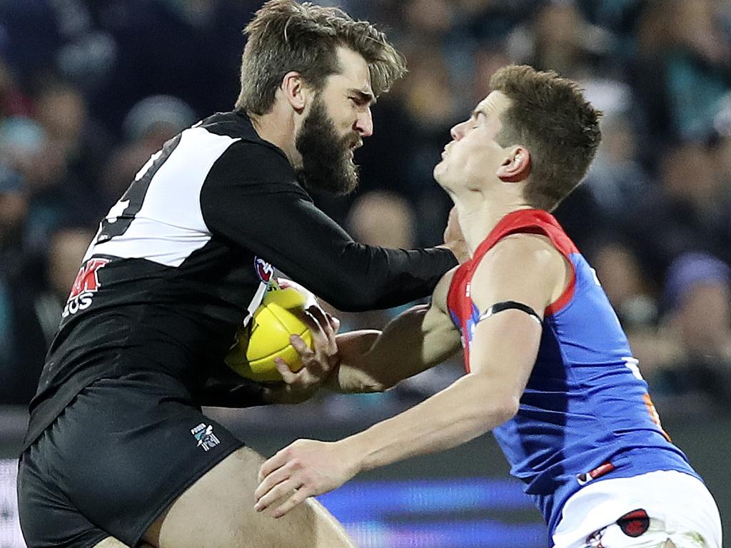 22/06/18 - AFL - Round 14 - Port Adelaide v Melbourne at Adelaide Oval. Justin Westhoff fends off Bayley Fritsch. Picture SARAH REED