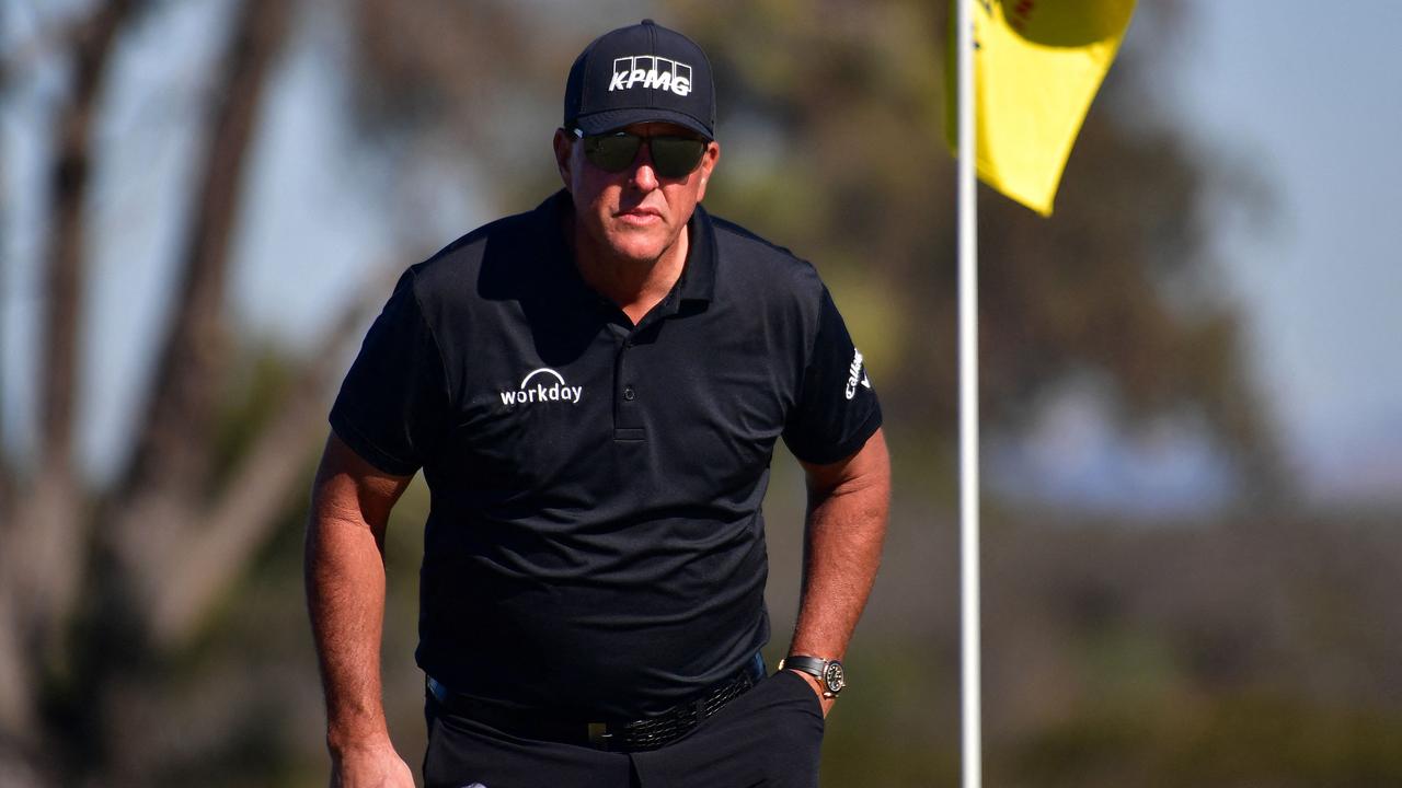 (FILES) In this file photo taken on January 27, 2022 Phil Mickelson lines up his putt on the 10th hole green during the second round of The Farmers Insurance Open on the North Course at Torrey Pines Golf Course in La Jolla, California. - Phil Mickelson confirmed on June 6, 2022 he has signed up to play in the lucrative Saudi-backed LIV Golf Invitational Series. The six-time major winner and 2021 PGA Championship winner has been confirmed in the field for the controversial new tour's inaugural event in London this week. (Photo by Donald MIRALLE / GETTY IMAGES NORTH AMERICA / AFP)