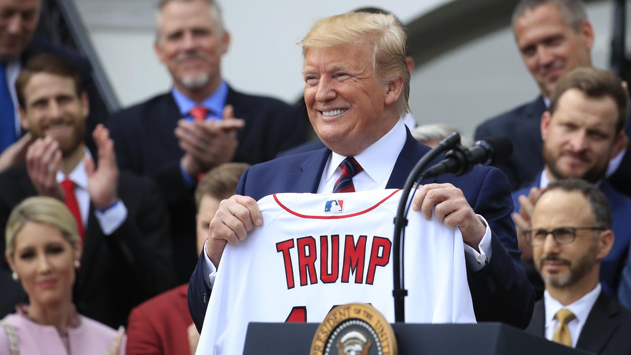 President Donald Trump shows off a Red Sox jersey presented to him during a ceremony welcoming the Boston Red Sox the 2018 World Series baseball champions to the White House on Thursday, May 9, 2019 Picture: Manuel Balce Ceneta/AP