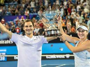 Roger Federer and Belinda Bencic of Switzerland celebrate their finals win at the Hopman Cup. Picture: Tony McDonough