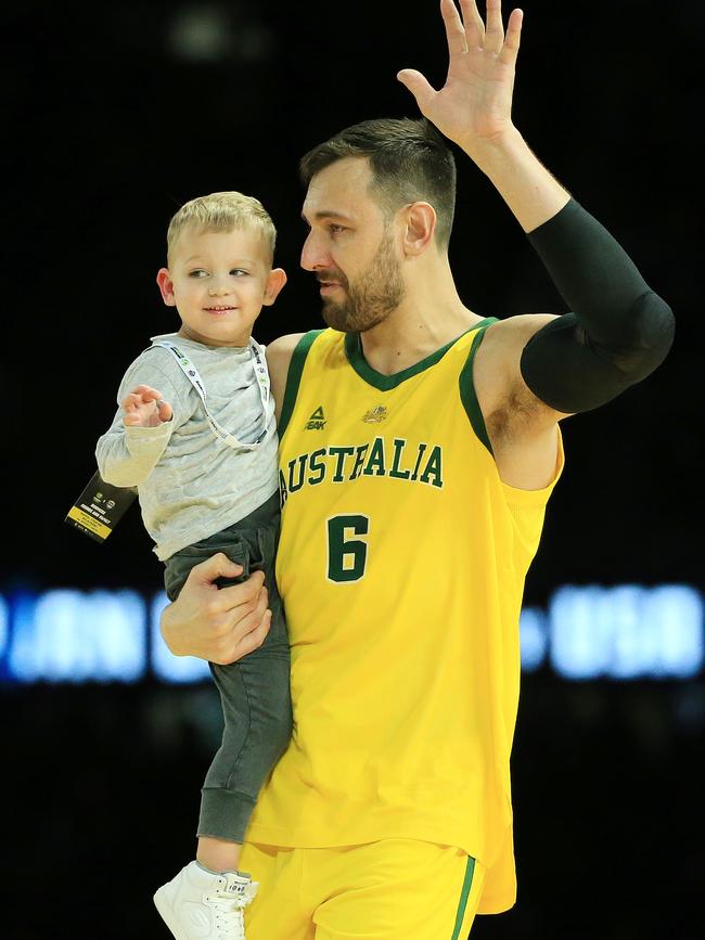 Andrew Bogut and his son celebrate the win. Picture: Mark Stewart