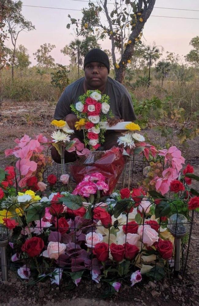 Janita Dixon, the daughter of alleged hit and run victim Kumanjayi Napurrurla Dixon, at her mother's roadside memorial.