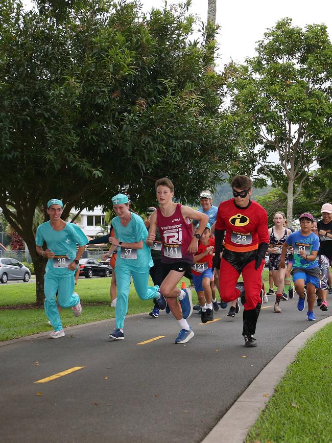 Miguel Groth, Astia Neckebroek, Zac Bennett and Patrick Markert lead the pack in the Cairns Regional Council's New Year's Eve superhero fun run on the Cairns Esplanade. Picture: Brendan Radke