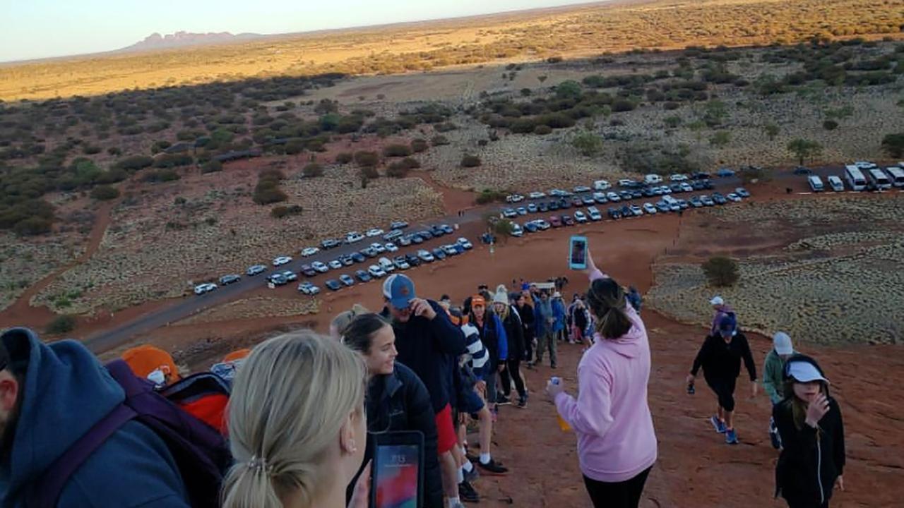 Tourists climbing Uluru in the final weeks before the climbing ban. Picture: @koki_mel_aus /AFP