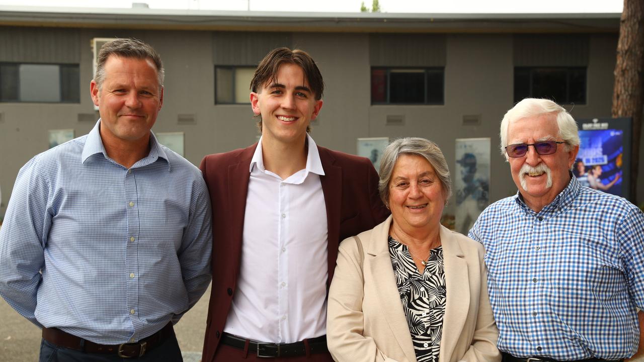 Graduate Cooper Sharrock with dad Colin and grandparents Julie and Noel Harris at the Belmont High School year 12 graduation at GMHBA Stadium. Picture: Alison Wynd