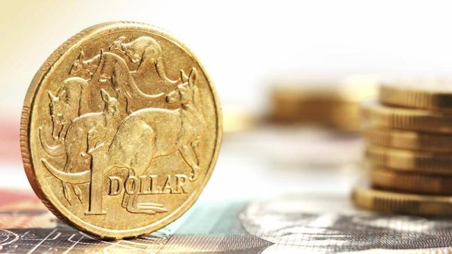Aussie one dollar coins, on a twenty dollar note.