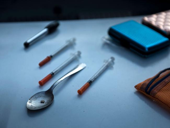 Paraphernalia for smoking and injecting drugs is seen after it was found during a police search on April 19, 2017, in Huntington, West Virginia. Huntington, the city in the northwest corner of West Virginia, bordering Kentucky, has been portrayed as the epicenter of the opioid crisis. On August 15, 2016, from 3:00 pm to 9:00 pm, 28 people in the city overdosed on heroin laced with fentanyl, a synthetic opioid far more powerful and dangerous than heroin. The economic incentives are powerful: one kilogram of fentanyl costs $5,000, which can make a million tablets sold at $20 each for a gain of $20 million. "This epidemic doesn't discriminate," Huntington Mayor Steve Williams said. "Our youngest overdose was 12 years old. The oldest was 77."  / AFP PHOTO / Brendan Smialowski / TO GO WITH AFP STORY by Heather SCOTT, US-health-drugs-WestVirginia