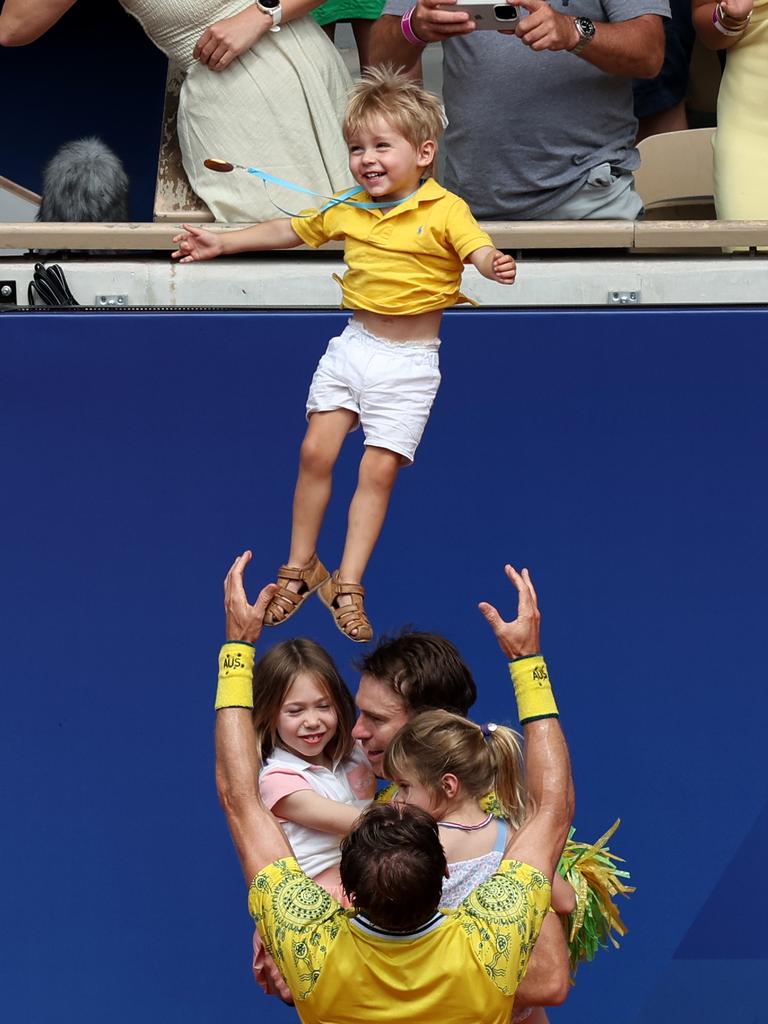 Matthew Ebden and John Peers win gold and celebrate with family.