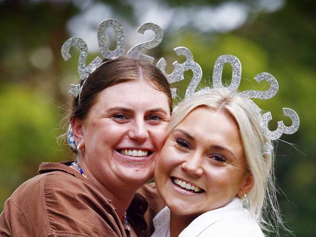 WEEKEND TELEGRAPHS -  31/12/22  MUST CHECK WITH PIC EDITOR JEFF DARMANIN BEFORE PUBLISHING  -NYE 2022 - People from across Sydney and tourists from all over the globe line up to get into Mrs Macquaries Chair to celebrate NYE 2022. Kate Vaughan (left) ad Abbie Evans pictured. Picture: Sam Ruttyn