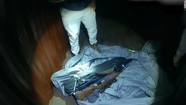 The rifle was allegedly found in a shipping container. Picture: Qld Police Service