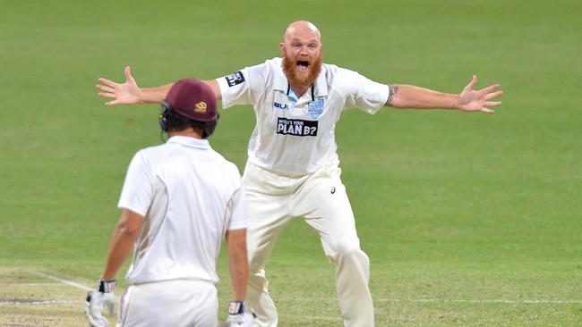 A low point of Howard’s tenure ... when Doug Bollinger ran through Queensland, after replacing Mitchell Starc mid-match. Picture: Getty Images