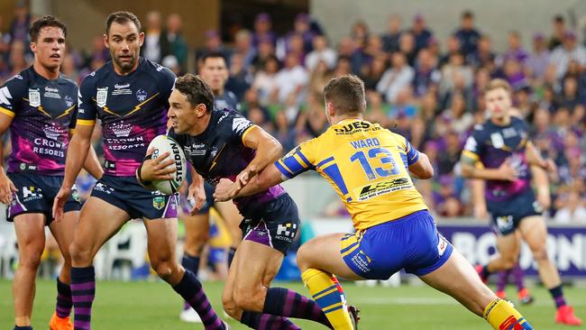 Billy Slater runs with the ball as Cameron Smith and Brodie Croft look on. Picture: Getty