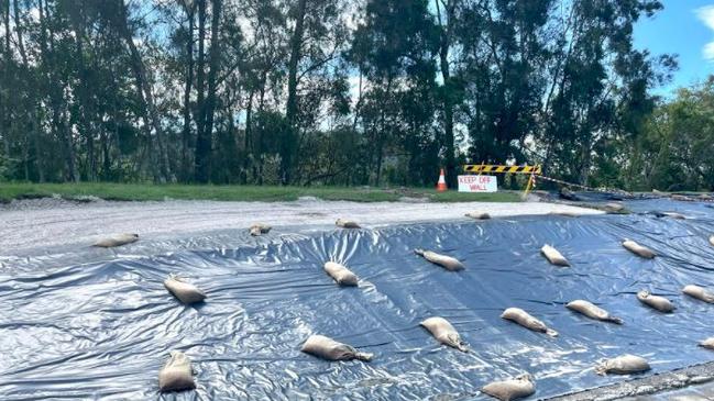 Hundreds of residents came together to sand bag the man-made and natural levees