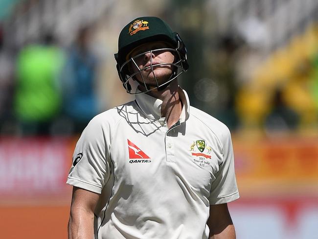 Australia's captain Steve Smith reacts as he walks back to the pavilion after his dismissal by India's Bhuvneshwar Kumar during the third day of the fourth and last Test cricket match between India and Australia at The Himachal Pradesh Cricket Association Stadium in Dharamsala on March 27, 2017. ----IMAGE RESTRICTED TO EDITORIAL USE - STRICTLY NO COMMERCIAL USE----- / GETTYOUT---- / AFP PHOTO / PRAKASH SINGH / ----IMAGE RESTRICTED TO EDITORIAL USE - STRICTLY NO COMMERCIAL USE----- / GETTYOUT
