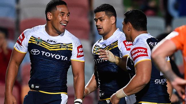 TOWNSVILLE, AUSTRALIA - AUGUST 09: Tautau Moga of the Cowboys celebrates after scoring a try during the round 22 NRL match between the North Queensland Cowboys and the Wests Tigers at 1300SMILES Stadium on August 9, 2014 in Townsville, Australia. (Photo by Ian Hitchcock/Getty Images)