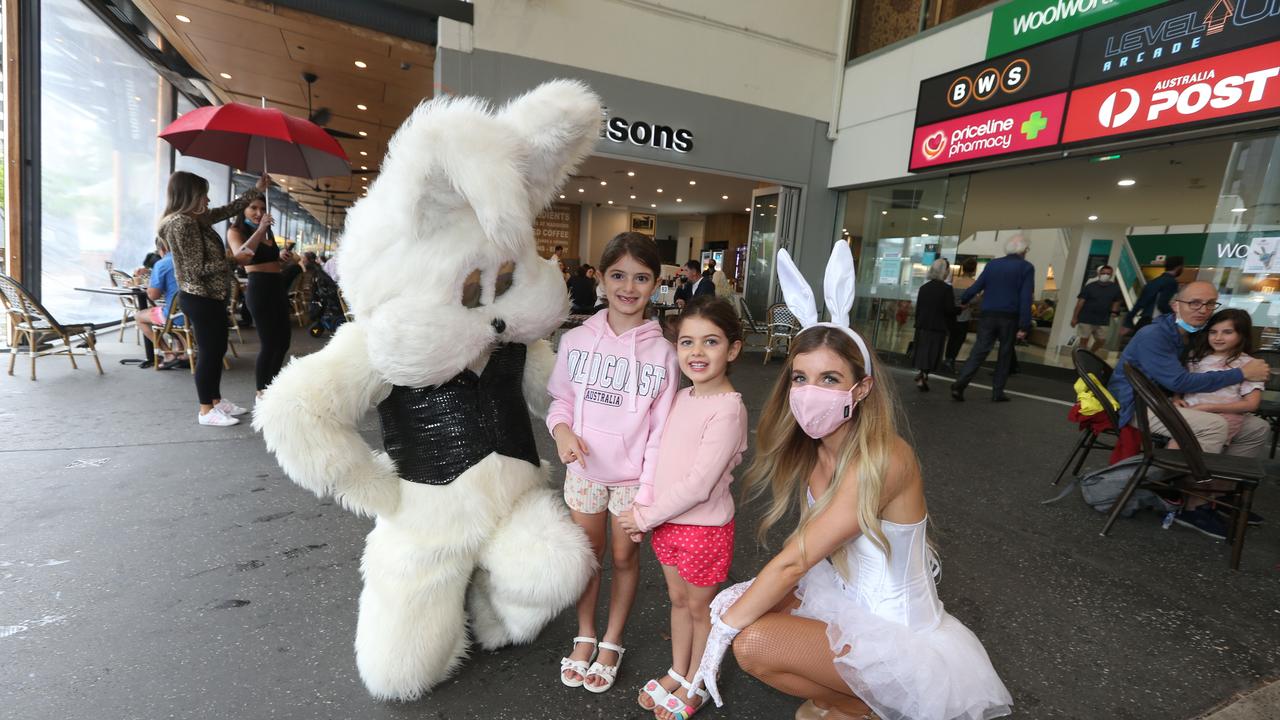 Easter Bunny with Brisbane visitors Maria Pozzias, 6, and her sister Katina Pozzias, 4, and Tasha Radford. Pic Mike Batterham