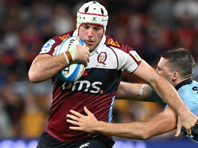 BRISBANE, AUSTRALIA - MARCH 15: Fraser McReight of the Reds takes on the defence during the round five Super Rugby Pacific match between Queensland Reds and NSW Waratahs at Suncorp Stadium, on March 15, 2025, in Brisbane, Australia. (Photo by Bradley Kanaris/Getty Images)