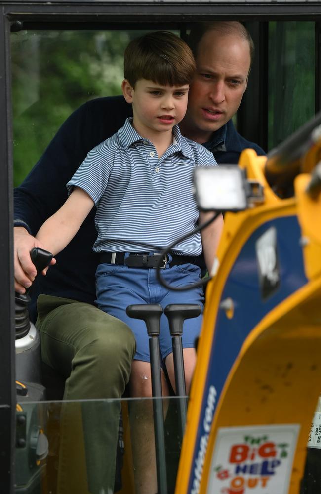 Prince William, Prince of Wales is helped by Prince Louis of Wales (L) as he uses an excavator while taking part in the Big Help Out. Picture: Getty Images