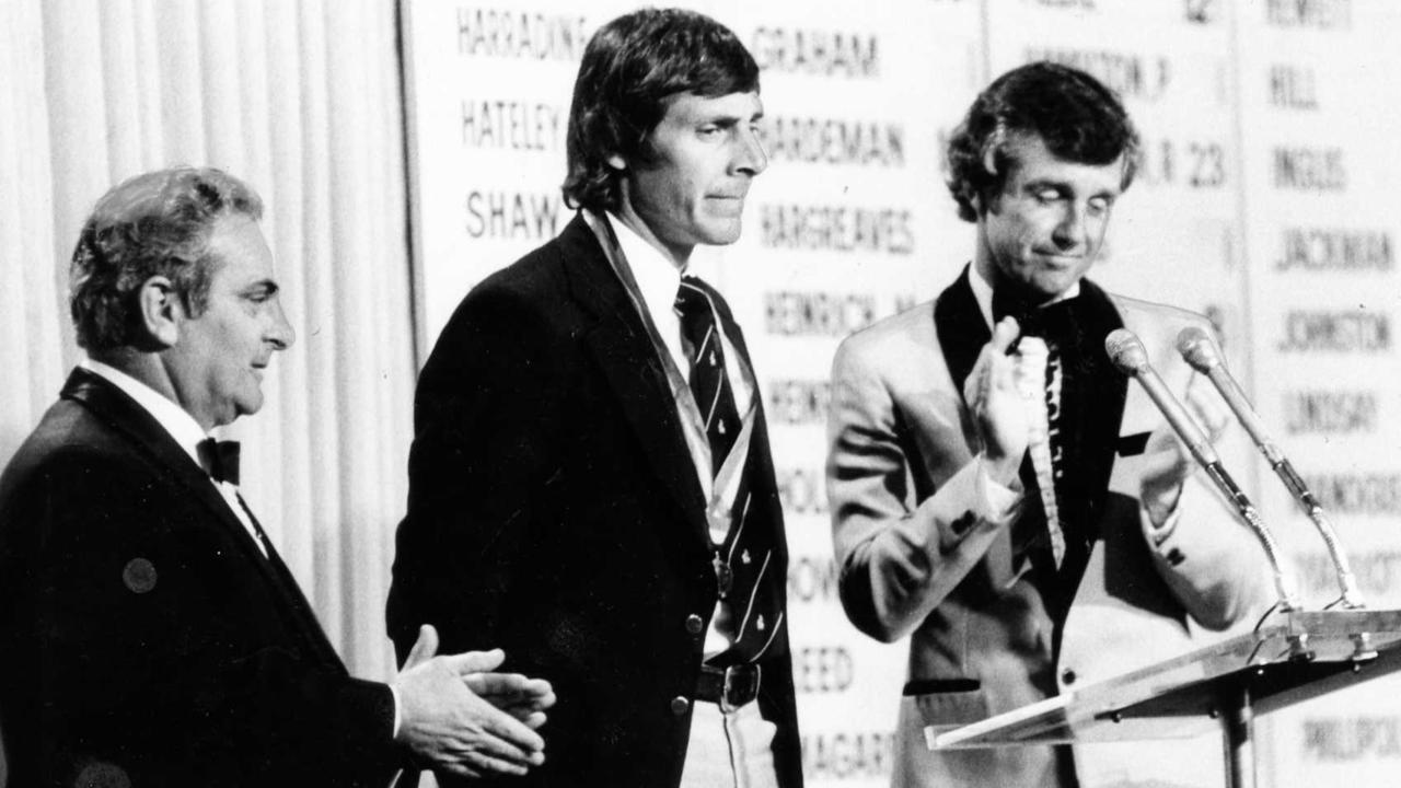 Russell Ebert is awarded his fourth Magarey Medal by SANFL president Max Basheer and presenter Ken Cunningham in 1980.