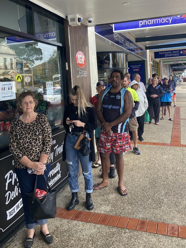 Large lines outside of Kempsey IGA as people start to stock up on supplies. Picture: Dan Mills