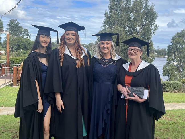 Graduates from the University of the Sunshine Coast's Fraser Coast campus celebrating at the Brolga Theatre.