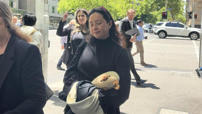 Victoria Police adviser Caitlin Schiavone leaves the Melbourne Magistrates Court. Picture: Mohammad Alfares