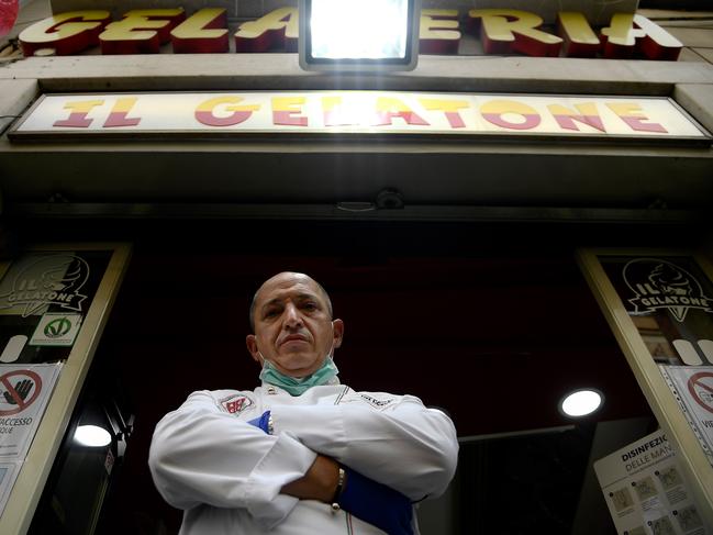 Ice cream shop owner Paolo Costantini poses in front of his Rome store, which is opened only for delivery. Picture: AFP