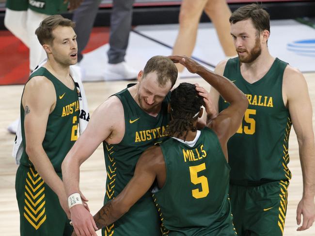 LAS VEGAS, NEVADA - JULY 10:  Patty Mills #5 of the Australia Boomers is congratulated by teammates Nathan Sobey #2, Joe Ingles #7 and Nick Kay #15 after Mills hit a 3-pointer against Argentina at the end of regulation of their exhibition game for an 87-84 win at Michelob ULTRA Arena ahead of the Tokyo Olympic Games on July 10, 2021 in Las Vegas, Nevada.  (Photo by Ethan Miller/Getty Images)