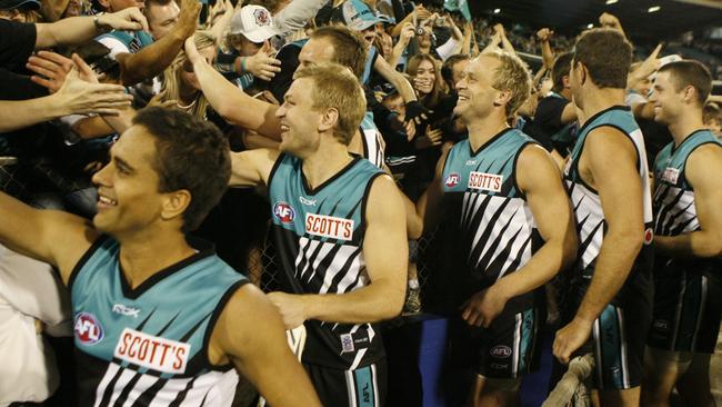 OFF TO THE BIG DANCE: Port Adelaide players, from left, Peter Burgoyne, Kane Cornes, Toby Thurstans, Chad Cornes, Brendon Lade and Michael Pettigrew, celebrate their 2007 preliminary final win against North Melbourne.