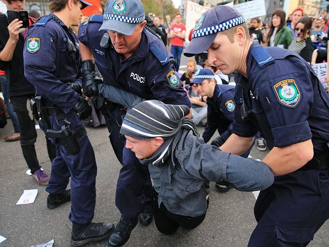 Demonstrators, protesting the Budget in Sydney at the weekend, were arrested by police. Picture by Mark Evans