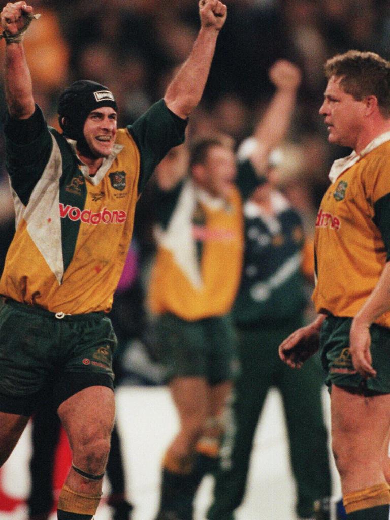 Wallaby player David Wilson with Andrew Blades celebrating a Bledisloe Cup match win.