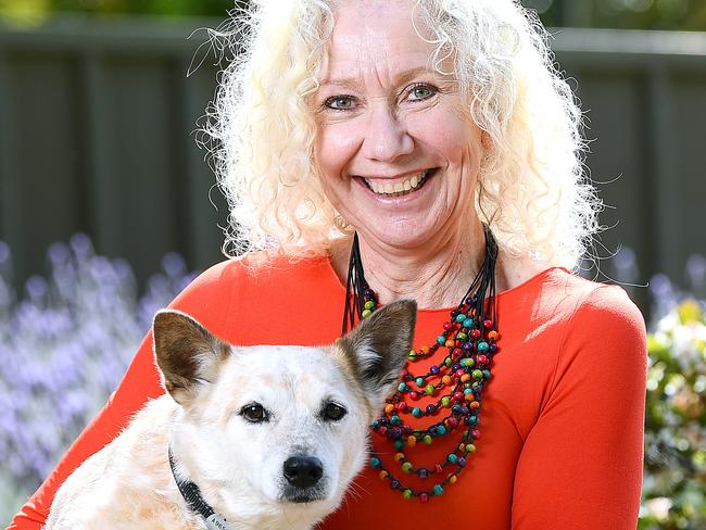 Liz Uren in her garden at her Morphettvale Home with her dog Ernie a 9 year old Red Heeler cross Jack Russell Friday September 11,2020.Picture Mark Brake