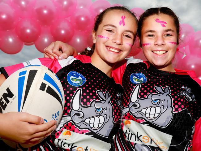 Rhinos Junior, Rugby League players Josephine Grima (11) and Ella Meredith (11) pose for photographs on the clubs annual Pink Day to raise funds for breast cancer in Castle Hill. Castle Hill, Saturday, July 28th 2018. The Rouse Hill Rhinos Junior Rugby League Club are holding their annual Pink Day to raise funds for breast cancer support. (AAP Image / Angelo Velardo)