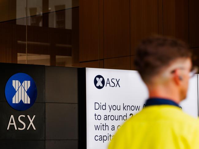 SYDNEY, AUSTRALIA - NewsWire Photos, October 29 2024. GENERIC. Stocks. Finance. Economy. A man in hi vis clothing walks past the Australian Stock Exchange, ASX, on Bridge Street. Picture: NewsWire / Max Mason-Hubers