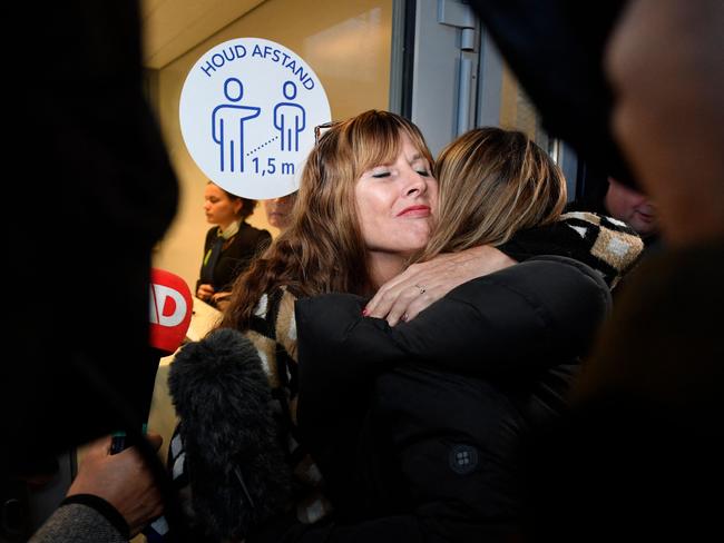 Victims' relatives embrace amid the trial of the MH17 downing case. Picture: AFP