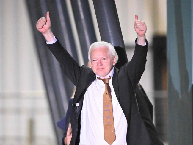 WikiLeaks founder Julian Assange gives thumbs up after arriving in Canberra. Picture: AFP