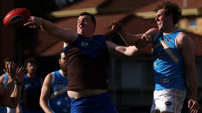 VAFA: Liam Adlington of Ormond battles Monash Blues’ Mitch King in the ruck. Photo: Hamish Blair