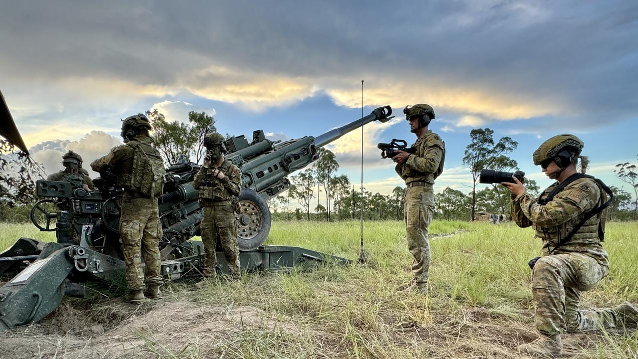 3rd Brigade Public Affairs photographers Corporal Brandon Grey and Trooper Dana Millington taking photos during exercise