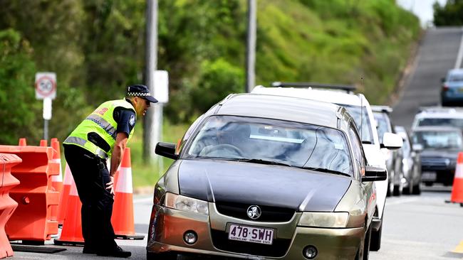 Police inspect vehicles crossing the border from New South Wales into Queensland at Coolangatta on the Gold Coast earlier this year. Picture: NCA NewsWire / Dan Peled