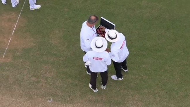 Umpires deliberate over the balls during the Fifth Ashes Test.