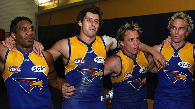 Former Eagles players celebrating a win (L-R David Wirrpanda, Andrew Embley, Daniel Chick and Mark Nicoski) [Photo by Paul Kane/Getty Images]