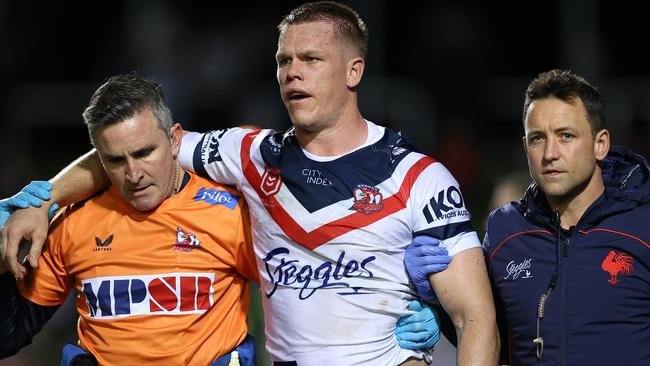 SYDNEY, AUSTRALIA - JULY 28:  Lindsay Collins of the Roosters is attended to by trainers after a head clash during the round 20 NRL match between the Manly Sea Eagles and the Sydney Roosters at 4 Pines Park on July 28, 2022, in Sydney, Australia. (Photo by Cameron Spencer/Getty Images)