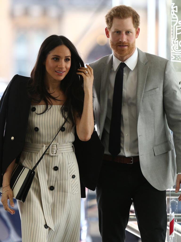 Prince Harry and Meghan Markle at a reception in the months before their wedding. Picture: Getty Images