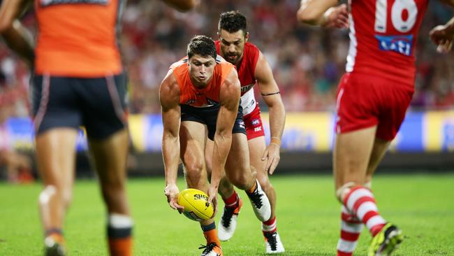 SYDNEY, NEW SOUTH WALES - APRIL 09: Jonathon Patton of the Giants handles the ball during the round three AFL match between the Sydney Swans and the Greater Western Sydney Giants at Sydney Cricket Ground on April 9, 2016 in Sydney, Australia. (Photo by Matt King/AFL Media/Getty Images)