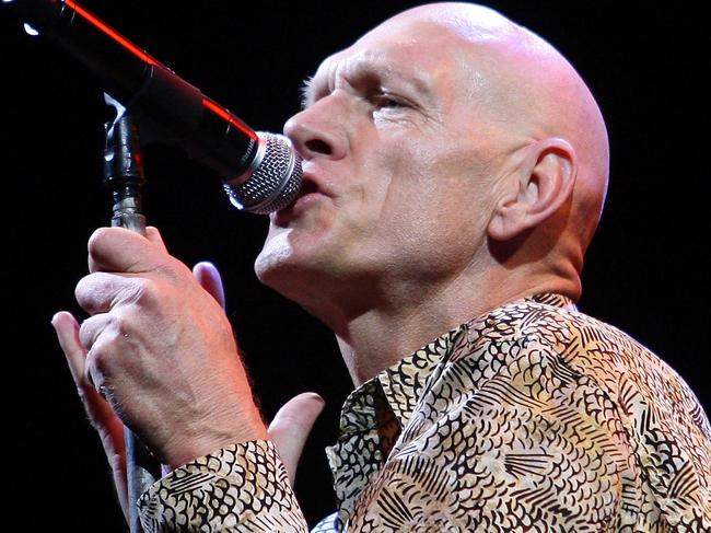 MELBOURNE, AUSTRALIA - MARCH 14:  Peter Garrett of the band Midnight Oil performs on stage during the Sound Relief concert at Melbourne Cricket Ground on March 14, 2009 in Melbourne, Australia. The simultaneous Melbourne and Sydney concerts have been organised to raise funds for victims of the recent Victorian bushfires and Queensland floods, with profits split equally between the two causes.  (Photo by Lucas Dawson/Getty Images)