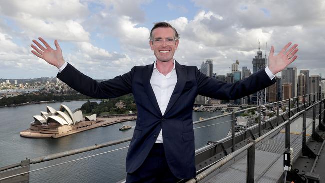 NSW Premier Dominic Perrottet pictured on top of the Sydney Harbour Bridge on Monday, is ready to welcome back cruise ships with open arms. Picture: Toby Zerna