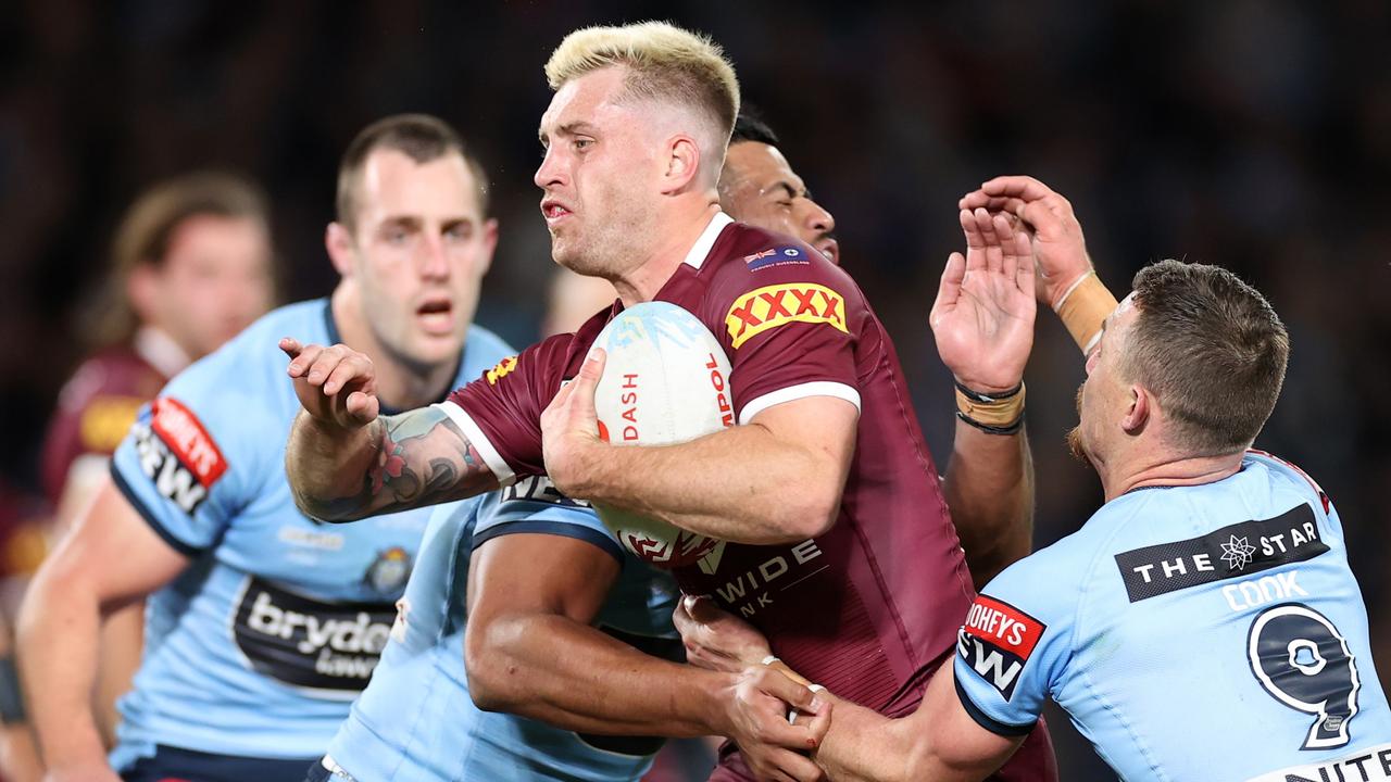 SYDNEY, AUSTRALIA - JUNE 08: Cameron Munster of the Maroons runs the ball during game one of the 2022 State of Origin series between the New South Wales Blues and the Queensland Maroons at Accor Stadium on June 08, 2022 in Sydney, Australia. (Photo by Cameron Spencer/Getty Images)